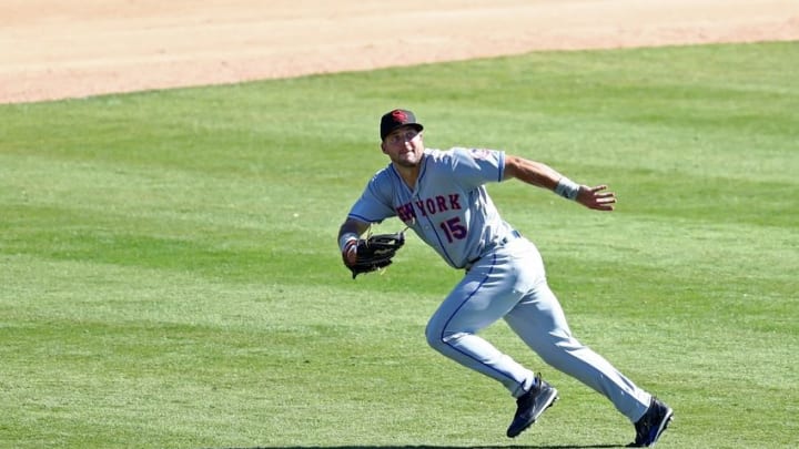 Oct 11, 2016; Glendale, AZ, USA; Scottsdale Scorpions outfielder Tim Tebow of the New York Mets tracks a fly ball against the Glendale Desert Dogs during an Arizona Fall League game at Camelback Ranch. Mandatory Credit: Mark J. Rebilas-USA TODAY Sports