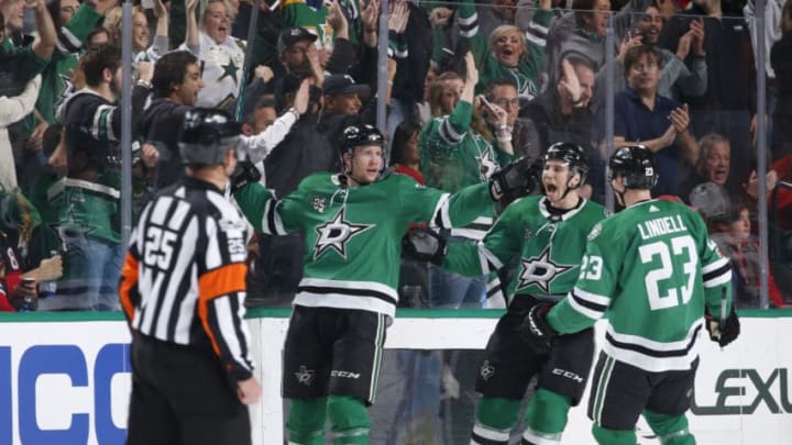 DALLAS, TX - DECEMBER 2: Radek Faksa #12, Esa Lindell #23, Tyler Pitlick #18 and the Dallas Stars celebrate a goal against the Chicago Blackhawks at the American Airlines Center on December 2, 2017 in Dallas, Texas. (Photo by Glenn James/NHLI via Getty Images)