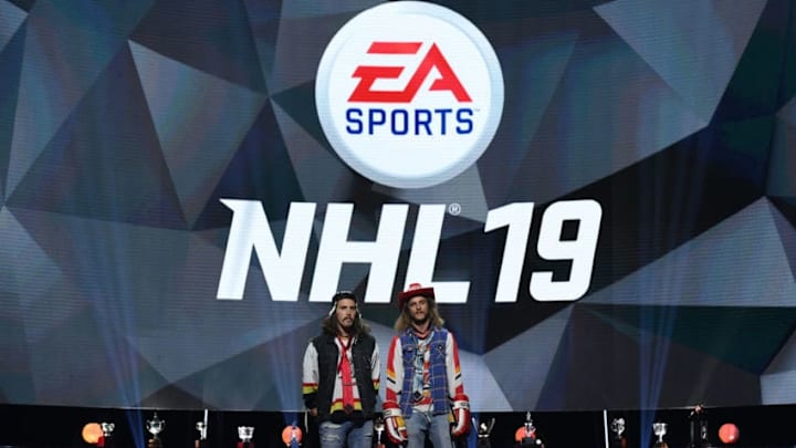 LAS VEGAS, NV - JUNE 20: Steve Campbell (L) and Ryan Russell, known as Olly Postanin and Jacob Ardown from "On the Bench," reveal the cover athlete for EA Sports' "NHL 19" during the 2018 NHL Awards presented by Hulu at The Joint inside the Hard Rock Hotel & Casino on June 20, 2018 in Las Vegas, Nevada. (Photo by Ethan Miller/Getty Images)