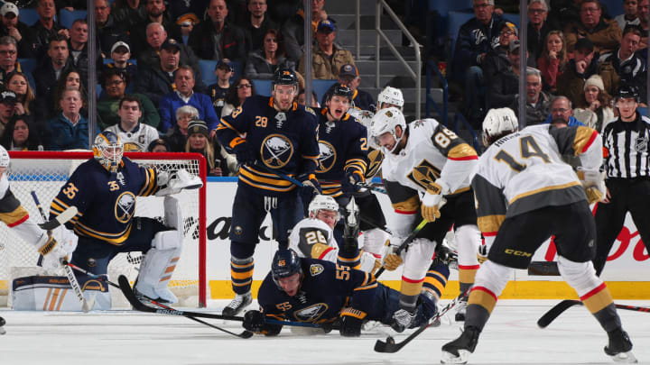 BUFFALO, NY – JANUARY 14: Linus Ullmark #35, Rasmus Ristolainen #55, Zemgus Girgensons #28, and Lawrence Pilut #24 of the Buffalo Sabres defend against Nicolas Hague #14 and Alex Tuch #89 of the Vegas Golden Knights during an NHL game on January 14, 2020 at KeyBank Center in Buffalo, New York. (Photo by Bill Wippert/NHLI via Getty Images)