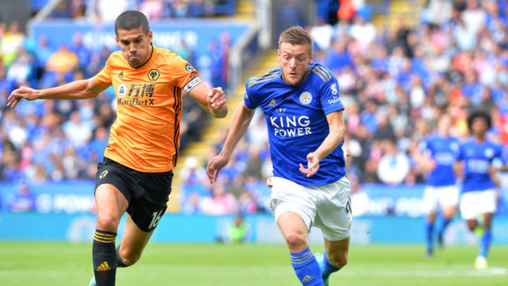 LEICESTER, ENGLAND - AUGUST 11: Jamie Vardy of Leicester City with Conor Coady of Wolverhampton Wanderers during the Premier League match between Leicester City and Wolverhampton Wanderers at King Power Stadium on August 11th , 2019 in Leicester, United Kingdom. (Photo by Plumb Images/Leicester City FC via Getty Images)