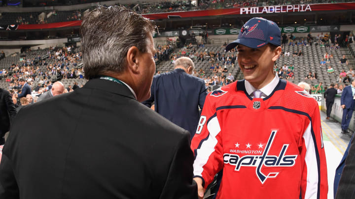 DALLAS, TX – JUNE 23: Mitchell Gibson greets his team after being selected 124th overall by the Washington Capitals during the 2018 NHL Draft at American Airlines Center on June 23, 2018 in Dallas, Texas. (Photo by Brian Babineau/NHLI via Getty Images)