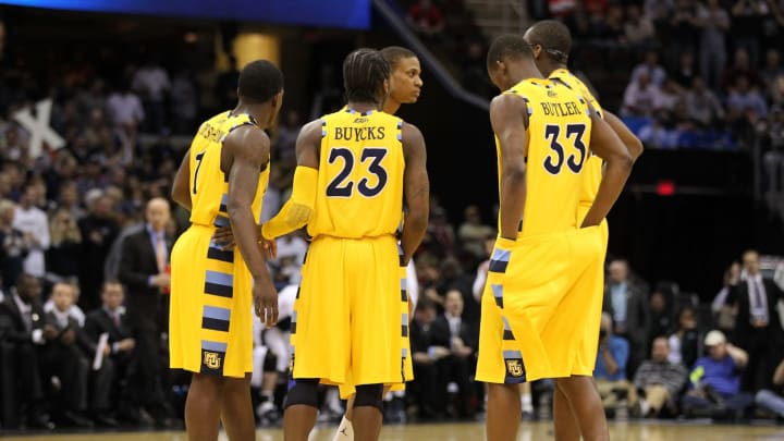 CLEVELAND, OH – MARCH 18: Darius Johnson-Odom #1, Dwight Buycks #23 and Jimmy Butler #33 of the Marquette Golden Eagles huddle with teammates during the game against the Xavier Musketeers during the second round of the 2011 NCAA men’s basketball tournament at Quicken Loans Arena on March 18, 2011 in Cleveland, Ohio. (Photo by Andy Lyons/Getty Images)