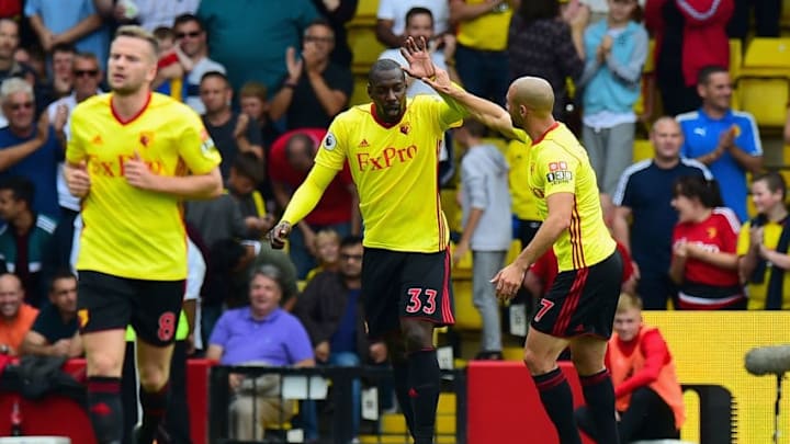 WATFORD, ENGLAND - AUGUST 12: Stefano Okaka of Watford celebrates scoring his sides first goal with Nordin Amrabat of Watford during the Premier League match between Watford and Liverpool at Vicarage Road on August 12, 2017 in Watford, England. (Photo by Tony Marshall/Getty Images)