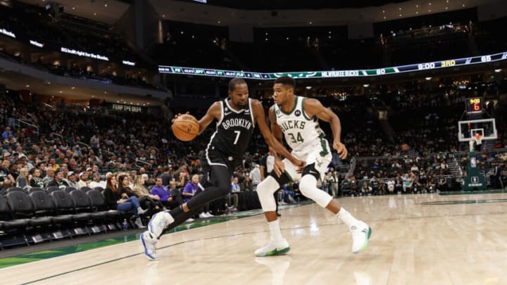 Oct 12, 2022; Milwaukee, Wisconsin, USA; Brooklyn Nets forward Kevin Durant (7) drives for the basket against Milwaukee Bucks forward Giannis Antetokounmpo (34) during the third quarter at Fiserv Forum. Mandatory Credit: Jeff Hanisch-USA TODAY Sports