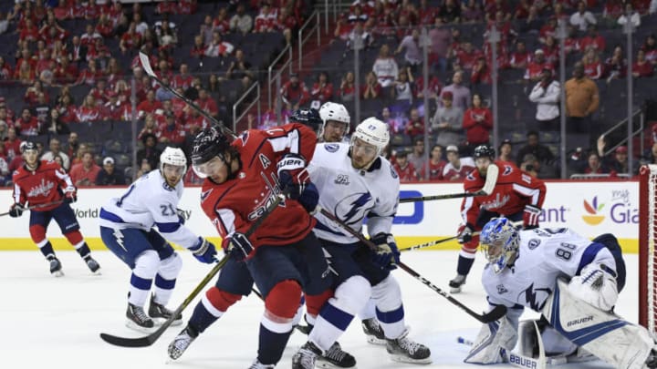 WASHINGTON, DC - MAY 15: T.J. Oshie #77 of the Washington Capitals battles for the puck against Ryan McDonagh #27 of the Tampa Bay Lightning in the third period in Game Three of the Eastern Conference Final during the 2018 NHL Stanley Cup Playoffs at Capital One Arena on May 15, 2018 in Washington, DC. (Photo by Patrick McDermott/NHLI via Getty Images)