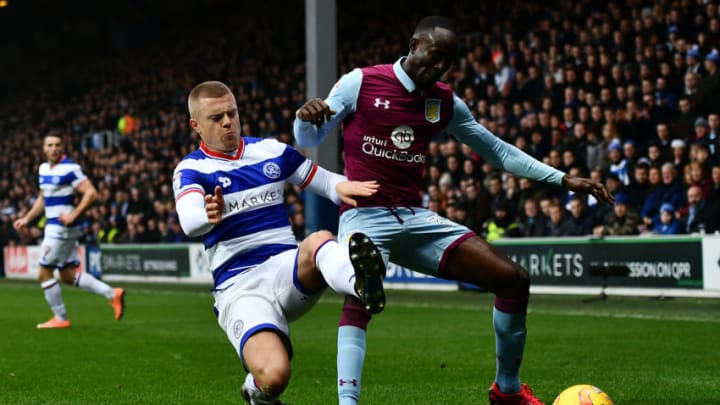 LONDON, ENGLAND - DECEMBER 18: Albert Adomah of Aston Villa holds off Jake Bidwell of Queens Park Rangers during the Sky Bet Championship match between Queens Park Rangers and Aston Villa at Loftus Road on December 18, 2016 in London, England. (Photo by Dan Mullan/Getty Images)