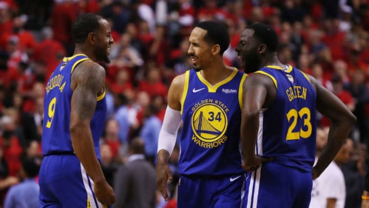 TORONTO, ONTARIO - JUNE 02: Andre Iguodala #9 is congratulated by his teammates Shaun Livingston #34 and Draymond Green #23 of the Golden State Warriors after scoring a basket against the Toronto Raptors in the second half during Game Two of the 2019 NBA Finals at Scotiabank Arena on June 02, 2019 in Toronto, Canada. NOTE TO USER: User expressly acknowledges and agrees that, by downloading and or using this photograph, User is consenting to the terms and conditions of the Getty Images License Agreement. (Photo by Gregory Shamus/Getty Images)