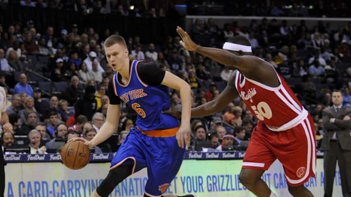 Jan 16, 2016; Memphis, TN, USA; New York Knicks forward Kristaps Porzingis (6) goes to the basket against Memphis Grizzlies forward Zach Randolph (50) during the first quarter at FedExForum. Mandatory Credit: Justin Ford-USA TODAY Sports