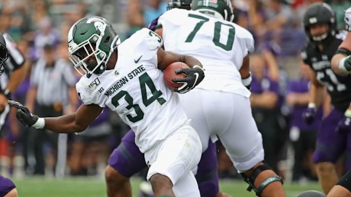 EVANSTON, ILLINOIS - SEPTEMBER 21: Anthony Williams Jr. #34 of the Michigan State Spartans breaks away from Alex Miller #95 of the Northwestern Wildcats at Ryan Field on September 21, 2019 in Evanston, Illinois. Michigan State defeated Northwestern 31-10. (Photo by Jonathan Daniel/Getty Images)