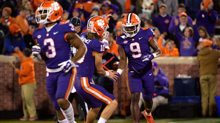 CLEMSON, SC - NOVEMBER 17: Trevor Lawrence #16 and Travis Etienne #9 of the Clemson Tigers celebrate following a 27-yard touchdown run by Etienne during their game against the Duke Blue Devils at Clemson Memorial Stadium on November 17, 2018 in Clemson, South Carolina. (Photo by Lance King/Getty Images) CLEMSON, SC - NOVEMBER 17: Trevor Lawrence #16 and Travis Etienne #9 of the Clemson Tigers celebrate following a 27-yard touchdown run by Etienne during their game against the Duke Blue Devils at Clemson Memorial Stadium on November 17, 2018 in Clemson, South Carolina. (Photo by Lance King/Getty Images)