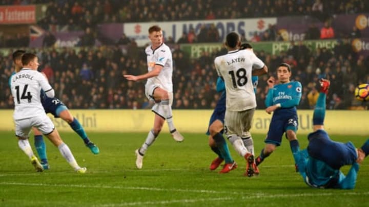 SWANSEA, WALES – JANUARY 30: Samuel Clucas of Swansea City scores his sides third goal during the Premier League match between Swansea City and Arsenal at Liberty Stadium on January 30, 2018 in Swansea, Wales. (Photo by Stu Forster/Getty Images)