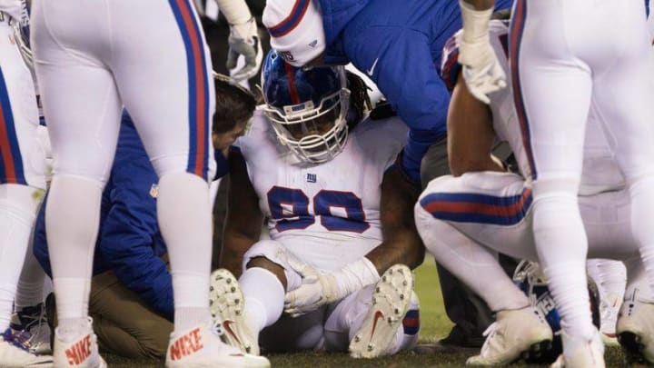 Dec 22, 2016; Philadelphia, PA, USA; New York Giants defensive tackle Damon Harrison (98) is tended to by trainers after being injured against the Philadelphia Eagles during the third quarter at Lincoln Financial Field. The Philadelphia Eagles won 24-19. Mandatory Credit: Bill Streicher-USA TODAY Sports