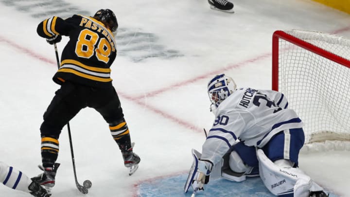 BOSTON - OCTOBER 22: Boston Bruins' David Pastrnak (88) scores the first goal of the game in the first period as he puts the puck between his own legs and then through the legs of Toronto goalie Michael Hutchinson (30). The Boston Bruins host the Toronto Maple Leafs in a regular season NHL hockey game at TD Garden in Boston on Oct. 22, 2019. (Photo by Jim Davis/The Boston Globe via Getty Images)