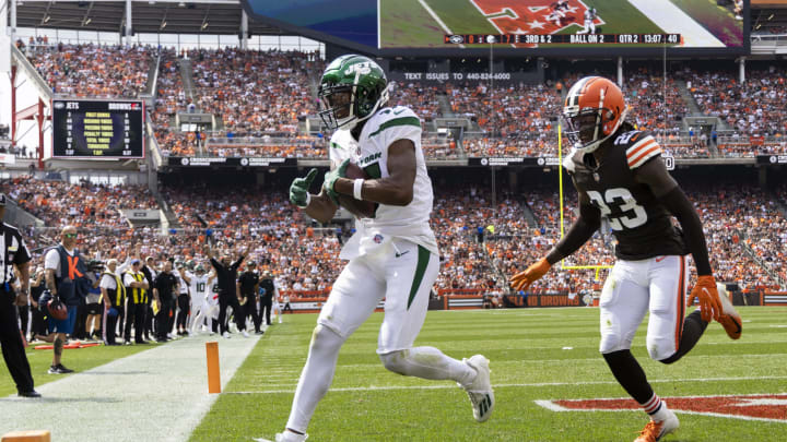 Sep 18, 2022; Cleveland, Ohio, USA; New York Jets wide receiver Garrett Wilson (17) makes a touchdown reception against Cleveland Browns cornerback Martin Emerson Jr. (23) during the second quarter at FirstEnergy Stadium. Mandatory Credit: Scott Galvin-USA TODAY Sports