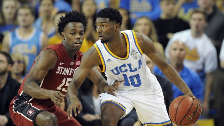 January 8, 2017; Los Angeles, CA, USA; UCLA Bruins guard Isaac Hamilton (10) moves the ball against the defense of Stanford Cardinal guard Marcus Allen (15) during the first half at Pauley Pavilion. Mandatory Credit: Gary A. Vasquez-USA TODAY Sports