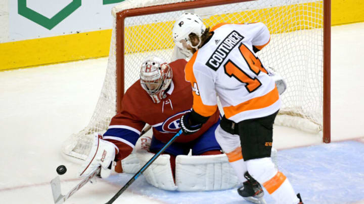 Aug 21, 2020; Toronto, Ontario, CAN; Montreal Canadiens goaltender Carey Price (31) makes a save against Philadelphia Flyers center Sean Couturier (14) during the second period in game six of the first round of the 2020 Stanley Cup Playoffs at Scotiabank Arena. Mandatory Credit: Dan Hamilton-USA TODAY Sports