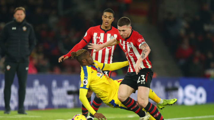 SOUTHAMPTON, ENGLAND - JANUARY 30: Wilfried Zaha of Crystal Palace battles for possession with Pierre-Emile Hojbjerg and Yan Valery of Southampton during the Premier League match between Southampton FC and Crystal Palace at St Mary's Stadium on January 30, 2019 in Southampton, United Kingdom. (Photo by Dan Istitene/Getty Images)