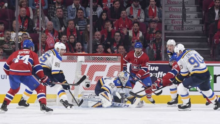 MONTREAL, QC - OCTOBER 12: Jordan Binnington #50 of the St Louis Blues makes a save in front of Joel Armia #40 of the Montreal Canadiens in the NHL game at the Bell Centre on October 12, 2019 in Montreal, Quebec, Canada. (Photo by Francois Lacasse/NHLI via Getty Images)