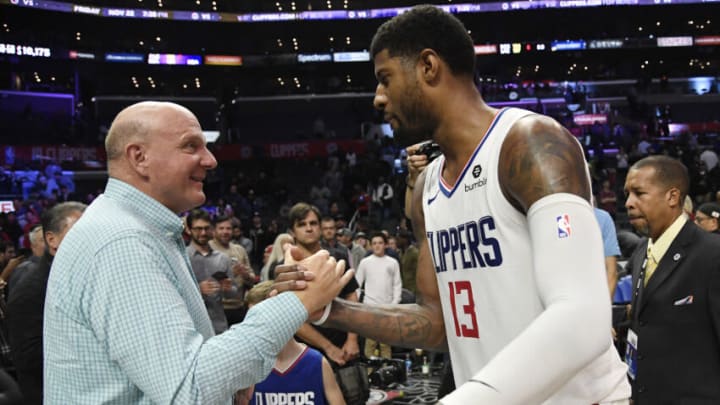 LOS ANGELES, CA - NOVEMBER 20: Paul George #13 of the Los Angeles Clippers is congratulated by owner owner Steve Ballmer after an overtime win over Boston Celtics, 107-104, at Staples Center on November 20, 2019 in Los Angeles, California. NOTE TO USER: User expressly acknowledges and agrees that, by downloading and/or using this Photograph, user is consenting to the terms and conditions of the Getty Images License Agreement. (Photo by Kevork Djansezian/Getty Images)