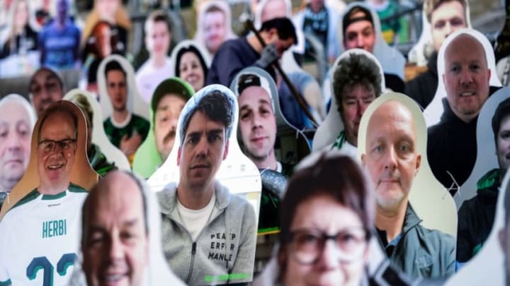 Cardboard cut-outs with portraits of Borussia Moenchegladbach's supporters are seen at the Borussia Park football stadium in Moenchengladbach, western Germany, on April 16, 2020, amid the novel coronavirus COVID-19 pandemic. - Large-scale public events such as football matches will remain banned in Germany until August 31 due to the coronavirus crisis, Berlin said on Wednesday, April 15, 2020, though it did not rule out allowing Bundesliga games to continue behind closed doors. (Photo by Ina FASSBENDER / AFP) (Photo by INA FASSBENDER/AFP via Getty Images)