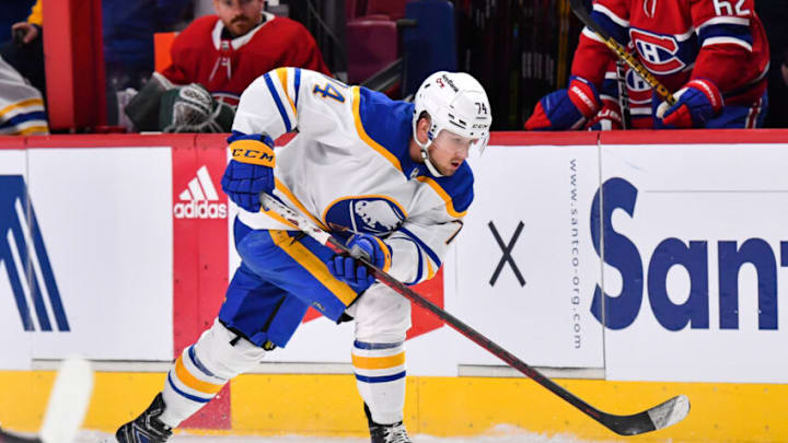 MONTREAL, QC - FEBRUARY 13: Rasmus Asplund #74 of the Buffalo Sabres skates the puck against the Montreal Canadiens during the third period at Centre Bell on February 13, 2022 in Montreal, Canada. The Buffalo Sabres defeated the Montreal Canadiens 5-3. (Photo by Minas Panagiotakis/Getty Images)