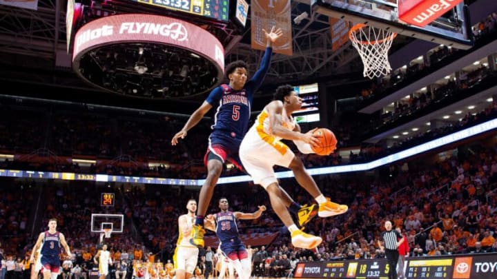 Tennessee guard Kennedy Chandler (1) attempts a shot while defended by Arizona guard Justin Kier (5) during a basketball game between the Tennessee Volunteers and the Arizona Wildcats at Thompson-Boling Arena in Knoxville, Tenn., on Wednesday, Dec. 22, 2021.Kns Vols Arizona Hoops Bp