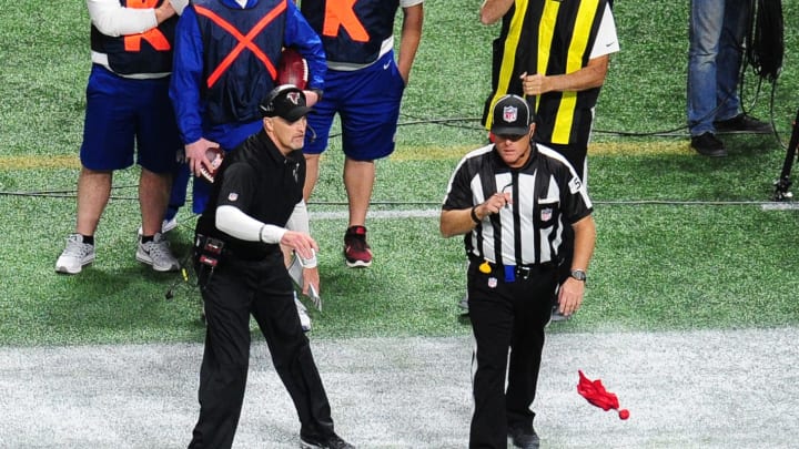 ATLANTA, GA – NOVEMBER 12: Head Coach Dan Quinn of the Atlanta Falcons throws the red flag to challenge a call by a referee during the game against the Dallas Cowboys at Mercedes-Benz Stadium on November 12, 2017 in Atlanta, Georgia. (Photo by Scott Cunningham/Getty Images)