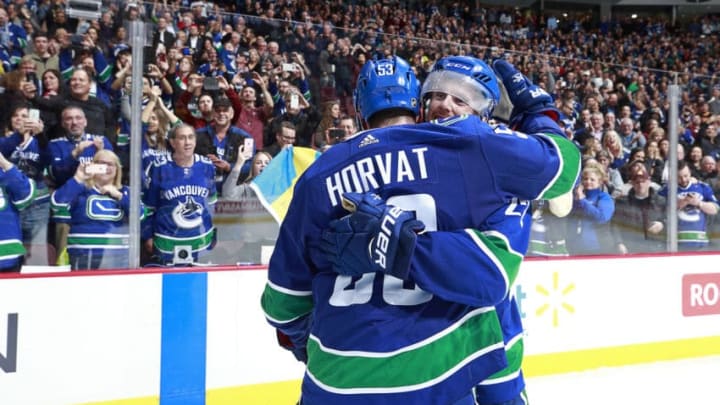 VANCOUVER, BC - APRIL 5: Daniel Sedin #22 of the Vancouver Canucks is congratulated by teammate Bo Horvat #53 after scoring the overtime winning goal during their NHL game against the Arizona Coyotes at Rogers Arena April 5, 2018 in Vancouver, British Columbia, Canada. (Photo by Jeff Vinnick/NHLI via Getty Images)"n