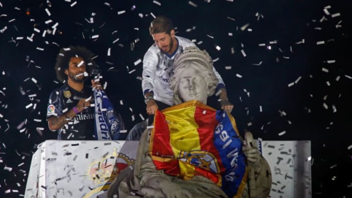 Real Madrid's Brazilian defender Marcelo (L) and Real Madrid's defender Sergio Ramos celebrate the team's win on Plaza Cibeles in Madrid on May 21, 2017 after the Sparish league football match Malaga CF vs Real Madrid CF held at La Rosaleda stadium in Malaga on May 21, 2017.Madrid sealed a first La Liga title in five years on Sunday -- and 33rd in total -- with a 2-0 victory at Malaga to bring a halt to Barcelona's domination of domestic matters having won six of the previous eight titles. / AFP PHOTO / OSCAR DEL POZO (Photo credit should read OSCAR DEL POZO/AFP/Getty Images)