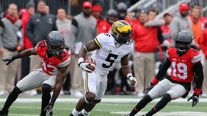 Nov 26, 2016; Columbus, OH, USA; Michigan Wolverines linebacker Jabrill Peppers (5) runs as Ohio State Buckeyes defenders Terry McLaurin (83) and Eric Glover-Williams (19) pursue during the second quarter at Ohio Stadium. Michigan Wolverines lead at half 10-7. Mandatory Credit: Joe Maiorana-USA TODAY Sports