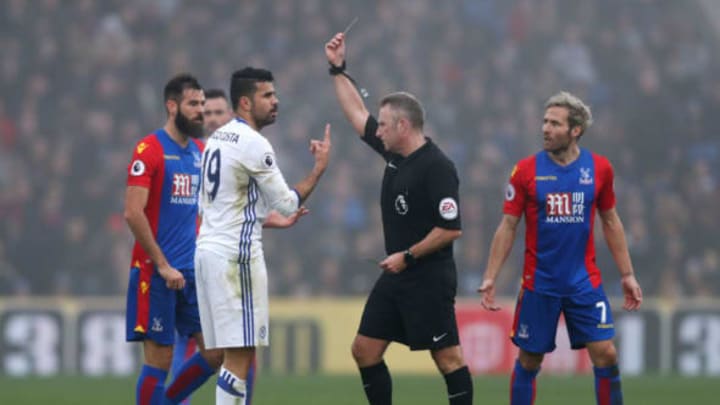 LONDON, ENGLAND – DECEMBER 17: Diego Costa of Chelsea (L) is shown a yellow card by Referee Jonathan Moss (C) during the Premier League match between Crystal Palace and Chelsea at Selhurst Park on December 17, 2016 in London, England. (Photo by Clive Rose/Getty Images)