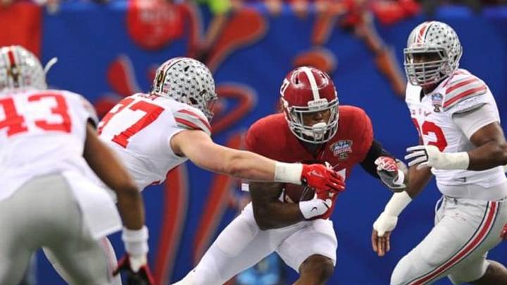 Jan 1, 2015; New Orleans, LA, USA; Alabama Crimson Tide running back Derrick Henry (27) carries the ball as Ohio State Buckeyes defensive lineman Joey Bosa (97) pursues in the first quarter of the 2015 Sugar Bowl at Mercedes-Benz Superdome. Mandatory Credit: Crystal LoGiudice-USA TODAY Sports