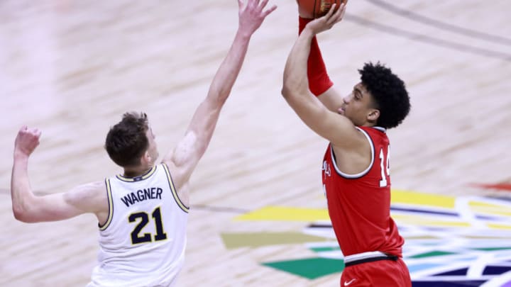 INDIANAPOLIS, INDIANA - MARCH 13: Justice Sueing #14 of the Ohio State Buckeyes takes a shot over Franz Wagner #21 of the Michigan Wolverines during the first half of the Big Ten men's basketball tournament semifinals at Lucas Oil Stadium on March 13, 2021 in Indianapolis, Indiana. (Photo by Justin Casterline/Getty Images)