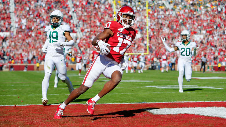 NORMAN, OK – NOVEMBER 5: Wide receiver Marvin Mims Jr. #17 of the Oklahoma Sooners scores on a 63-yard touchdown catch against cornerback AJ McCarty #19 of the Baylor Bears in the first quarter at Gaylord Family Oklahoma Memorial Stadium on November 5, 2022 in Norman, Oklahoma. Baylor won 38-35. (Photo by Brian Bahr/Getty Images)