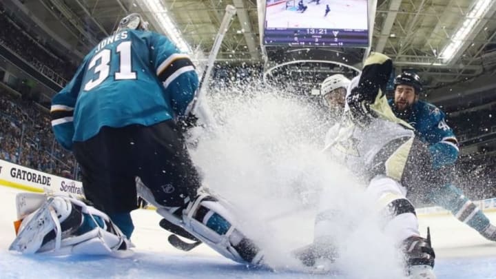 Jun 6, 2016; San Jose, CA, USA; San Jose Sharks goalie Martin Jones (31) is sprayed with snow by Pittsburgh Penguins right wing Bryan Rust (17) as Sharks defenseman Roman Polak (46) defends in the third period in game four of the 2016 Stanley Cup Final at SAP Center at San Jose. Mandatory Credit: Bruce Bennett/Pool Photo via USA TODAY Sports