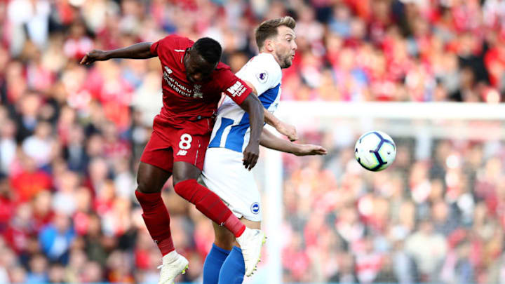 LIVERPOOL, ENGLAND - AUGUST 25: Naby Keita of Liverpool battles for posession in the air with Dale Stephens of Brighton and Hove Albion during the Premier League match between Liverpool FC and Brighton & Hove Albion at Anfield on August 25, 2018 in Liverpool, United Kingdom. (Photo by Jan Kruger/Getty Images)