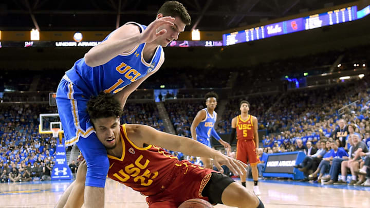 LOS ANGELES, CA – FEBRUARY 03: Alex Olesinski #0 of the UCLA Bruins guards Bennie Boatwright #25 of the USC Trojans as he slips driving to the basket in the second half at Pauley Pavilion on February 3, 2018 in Los Angeles, California. (Photo by Jayne Kamin-Oncea/Getty Images)