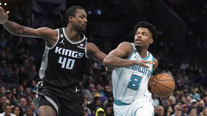 Oct 31, 2022; Charlotte, North Carolina, USA; Charlotte Hornets guard Dennis Smith Jr. (8) drives while defended by Sacramento Kings forward Harrison Barnes (40) during the second half at the Spectrum Center. Mandatory Credit: Sam Sharpe-USA TODAY Sports