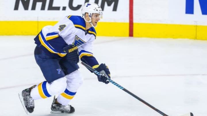 Oct 13, 2015; Calgary, Alberta, CAN; St. Louis Blues defenseman Carl Gunnarsson (4) controls the puck against the Calgary Flames during the third period at Scotiabank Saddledome. St. Louis Blues won 4-3. Mandatory Credit: Sergei Belski-USA TODAY Sports