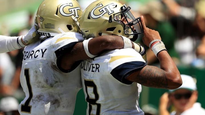 TAMPA, FL – SEPTEMBER 08: Tobias Oliver #8 of the Georgia Tech Yellow Jackets celebrates a touchdown during a game against the South Florida Bulls at Raymond James Stadium on September 8, 2018 in Tampa, Florida. (Photo by Mike Ehrmann/Getty Images)