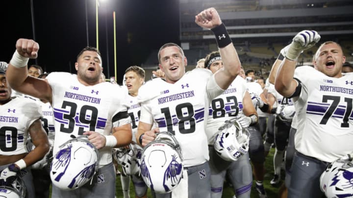 WEST LAFAYETTE, IN - AUGUST 30: Clayton Thorson #18 of the Northwestern Wildcats celebrates with his teammates after a game against the Purdue Boilermakers at Ross-Ade Stadium on August 30, 2018 in West Lafayette, Indiana. Northwestern won 31-27. (Photo by Joe Robbins/Getty Images)