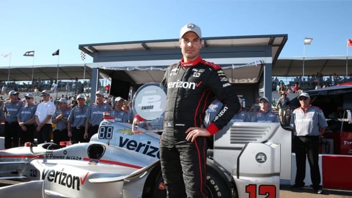 Team Penske's Will Power poses with his Verizon P1 Award after winning the pole position for Sunday's Firestone Grand Prix of St. Petersburg. Photo Credit: Chris Jones/Courtesy of IndyCar