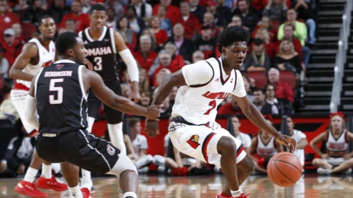 LOUISVILLE, KY - NOVEMBER 17: Darius Perry #2 of the Louisville Cardinals knocks the ball away from KJ Robinson #5 of the Omaha Mavericks in the first half of a game at KFC YUM! Center on November 17, 2017 in Louisville, Kentucky. Louisville won 87-78. (Photo by Joe Robbins/Getty Images)