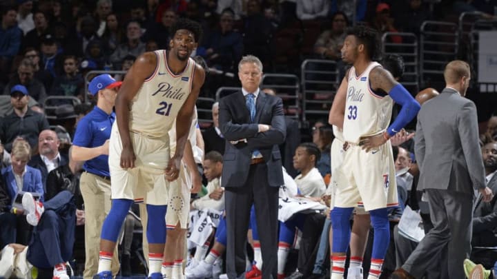 PHILADELPHIA, PA - MARCH 16: Joel Embiid #21 Head Coach Brett Brown and Robert Covington #33 of the Philadelphia 76ers look onduring the game against the Brooklyn Nets on March 16, 2018 at the Wells Fargo Center in Philadelphia, Pennsylvania. NOTE TO USER: User expressly acknowledges and agrees that, by downloading and or using this Photograph, user is consenting to the terms and conditions of the Getty Images License Agreement. Mandatory Copyright Notice: Copyright 2018 NBAE (Photo by David Dow/NBAE via Getty Images)
