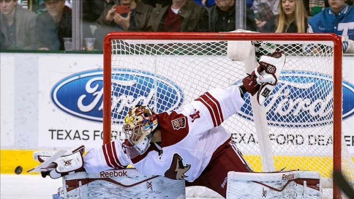 Feb 8, 2014; Dallas, TX, USA; Phoenix Coyotes goalie Mike Smith (41) makes a save against a Dallas Stars shot during the third period at the American Airlines Center. The Stars defeated the Coyotes 2-1. Mandatory Credit: Jerome Miron-USA TODAY Sports