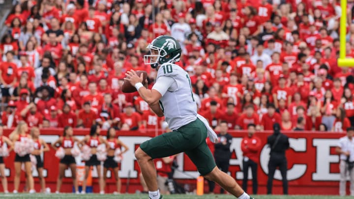 Oct 9, 2021; Piscataway, New Jersey, USA; Michigan State Spartans quarterback Payton Thorne (10) moves out to pass during the first half against the Rutgers Scarlet Knights at SHI Stadium. Mandatory Credit: Vincent Carchietta-USA TODAY Sports