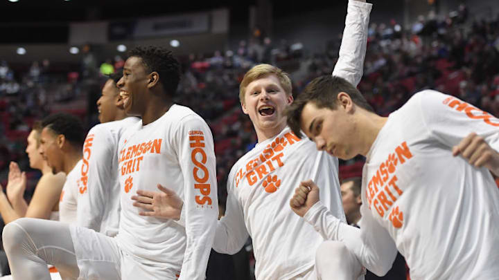 ncaa basketball picks: SAN DIEGO, CA - MARCH 16: The Clemson Tigers bench celebrates as they take on the New Mexico State Aggies in the second half in the first round of the 2018 NCAA Men's Basketball Tournament at Viejas Arena on March 16, 2018 in San Diego, California. The Clemson Tigers won 79-68. (Photo by Donald Miralle/Getty Images)