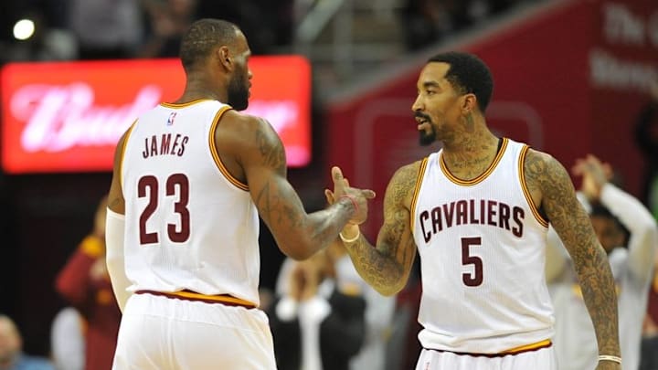 Mar 21, 2016; Cleveland, OH, USA; Cleveland Cavaliers forward LeBron James (23) celebrates with guard J.R. Smith (5) while leaving the game with a triple-double during the fourth quarter against the Denver Nuggets at Quicken Loans Arena. The Cavs won 124-91. Mandatory Credit: Ken Blaze-USA TODAY Sports