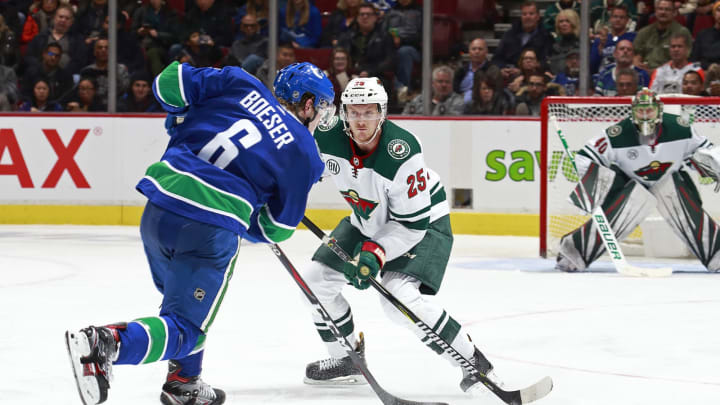 Jonas Brodin of the Minnesota Wild and Brock Boeser of the Vancouver Canucks (Photo by Jeff Vinnick/Getty Images)